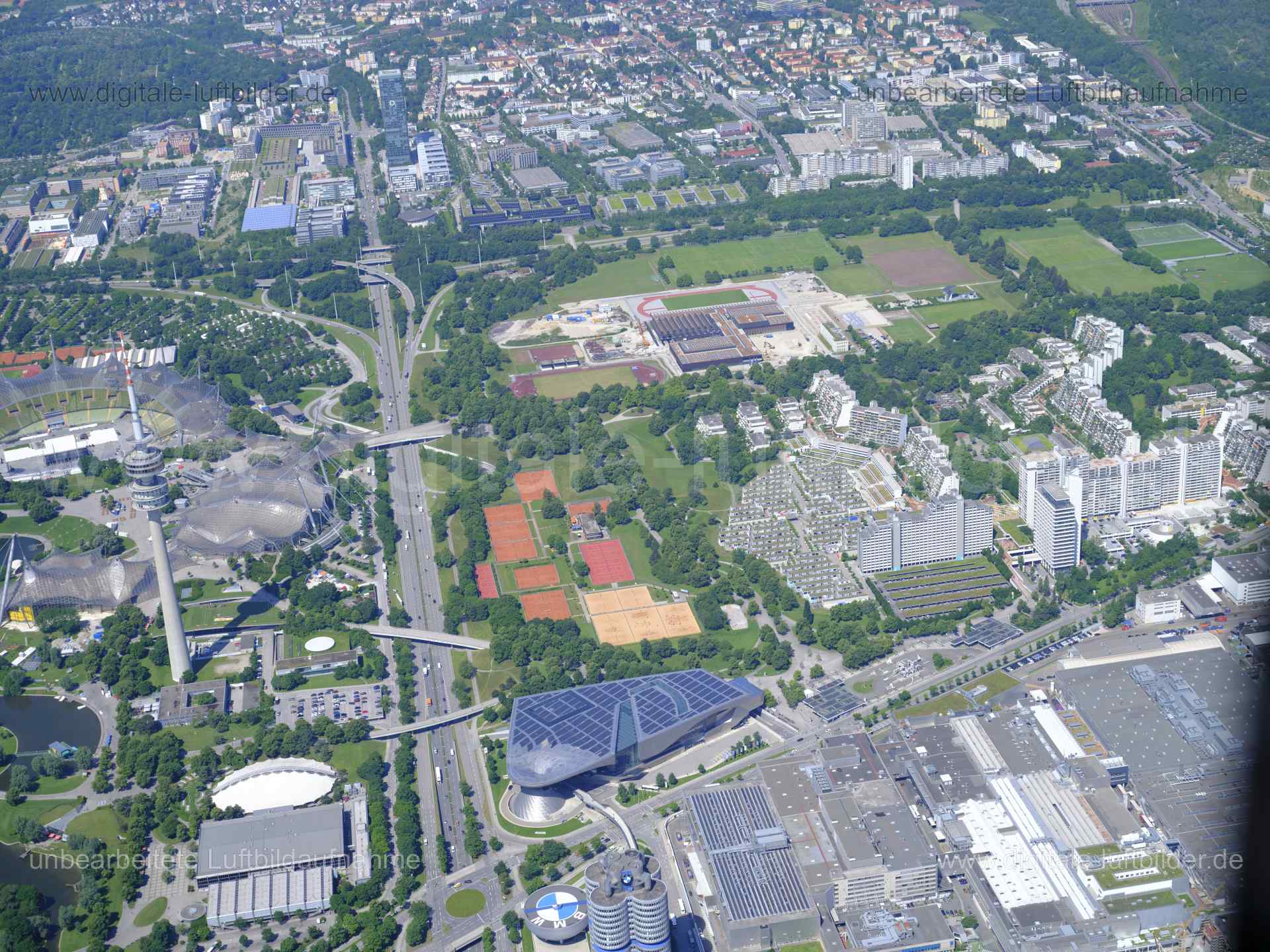 Titel: Olympiapark Nord, Bildnummer: f481680, Ort / Stadt: München, (Land)Kreis: kreisfreie Stadt München, Regierungsbezirk: Oberbayern, Bundesland: Bayern, Aufnahmedatum: 14.06.2022, Schlagwörter: Luftbild, Luftbilder, Luftbildfotografie, Luftaufnahme, Luftbildaufnahme, Luftfoto, Luftbildarchiv, Luftbildsuche, Vogelperspektive, Vogelansicht, Deutschland, , Olympiapark, Olympiahalle, Olympiastadion, Großer Olympiasee, Georg-Brauchle-Ring, Olympiaturm, Olympiapark Nord, Monat: Juni, Jahreszeit: S