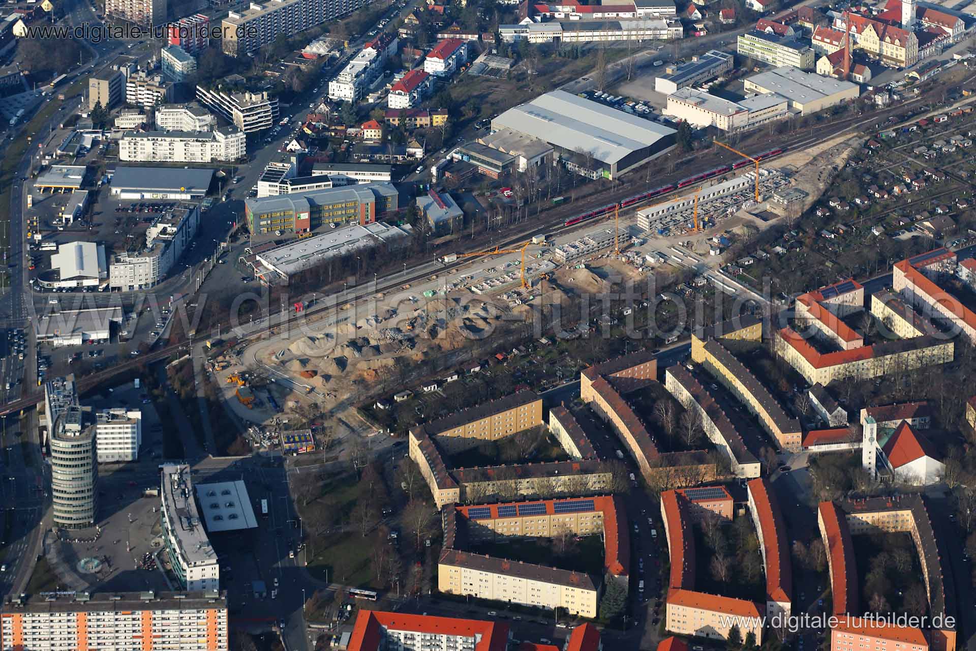 Titel: Großbaustelle Kieslingstraße, Bildnummer: c081860, Ort / Stadt: Nürnberg, (Land)Kreis: kreisfreie Stadt Nürnberg, Regierungsbezirk: Mittelfranken, Bundesland: Bayern, Aufnahmedatum: 08.03.2014, Schlagwörter: Luftbild, Luftbilder, Luftbildfotografie, Luftaufnahme, Luftbildaufnahme, Luftfoto, Vogelperspektive, Vogelansicht, Deutschland, Schräg- und Senkrecht-Luftaufnahmen, Orthofotografie, Großbaustelle, Kieslingstraße, Nordostbahnhof, Leipziger Platz, Baustelle, Gewerbeflächen & Gewerbeimm